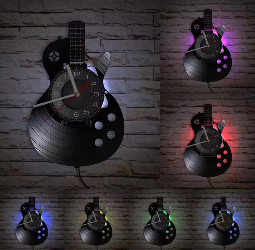This Guitare LED Vinyl Record Clock brings a polished clock design and decorative character to the wall.