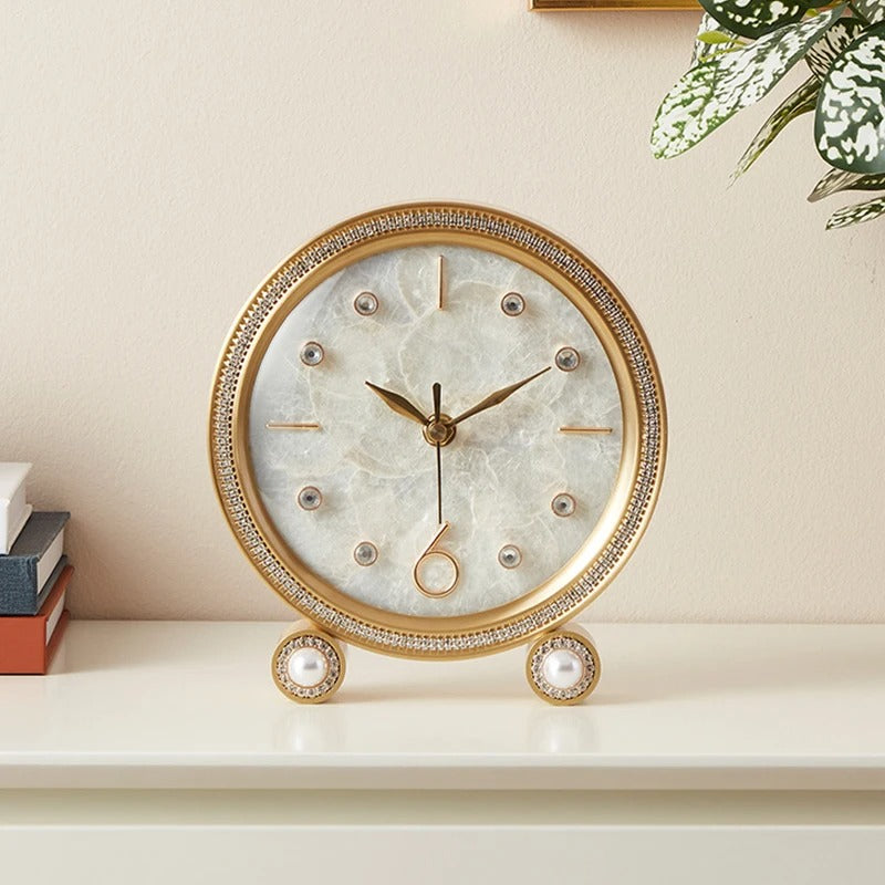 This Tabletop Clock brings a polished clock design and decorative character to the wall.