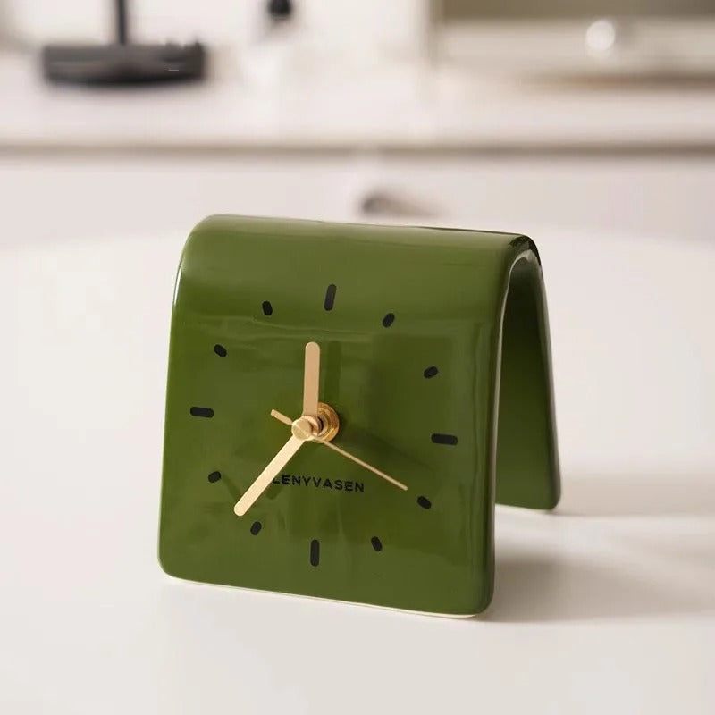 An elegant Ceramic Tabletop Clock designed to give a room a memorable decorative detail.