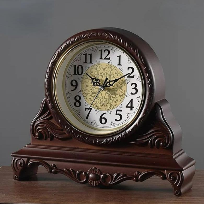 This Antique Tabletop Clock brings a polished clock design and decorative character to the wall.