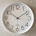 An elegant White Clock designed to give a room a memorable decorative detail.