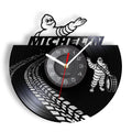 This Michelin Clock brings a polished clock design and decorative character to the wall.
