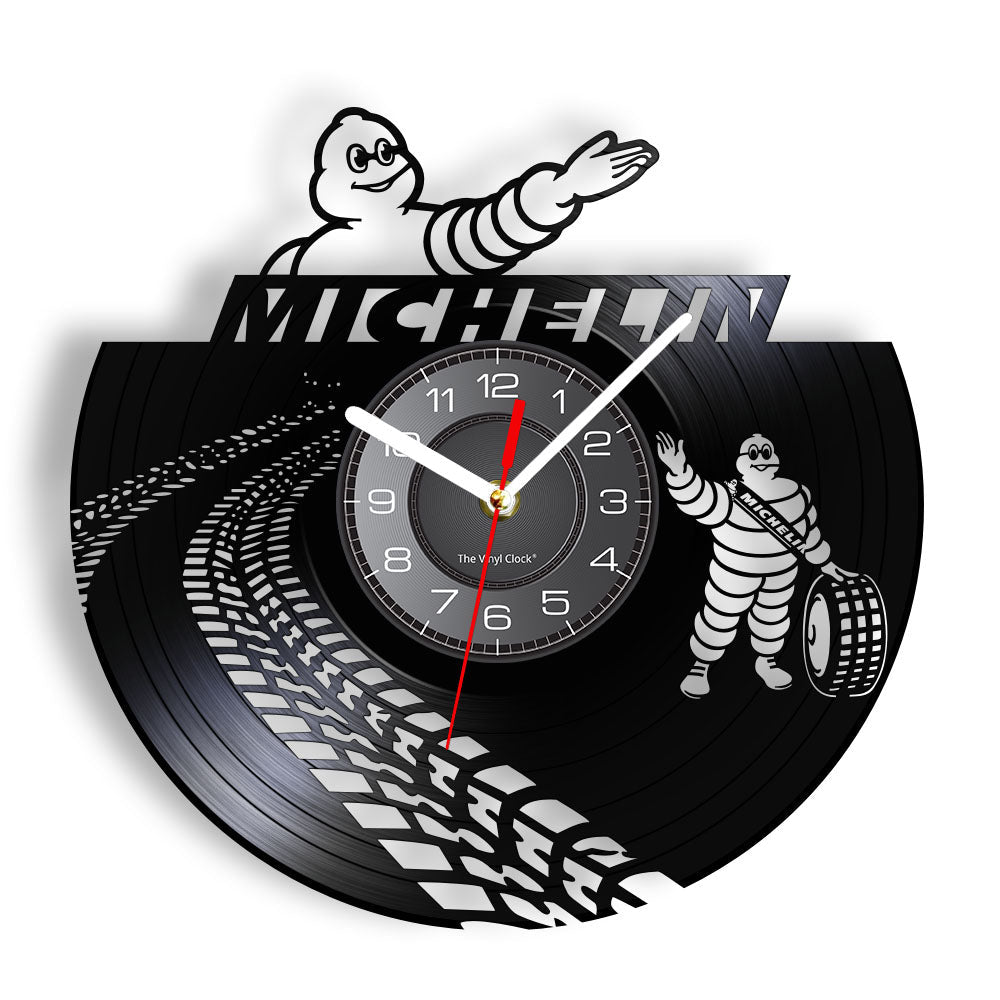 This Michelin Clock brings a polished clock design and decorative character to the wall.