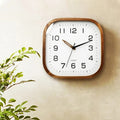 A Wood Squaree Wall Clock with a distinctive presence, made to enhance a curated interior.