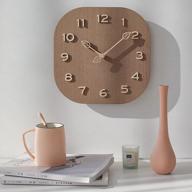 This Wood Modern Wall Clock adds a tailored balance of function and visual interest to home decor.