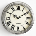 This Roman Numerals Wall Clock adds a tailored balance of function and visual interest to home decor.