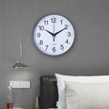 This Quartz Clock adds a tailored balance of function and visual interest to home decor.