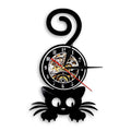 This Cat Black Vinyl Record Clock brings a polished clock design and decorative character to the wall.