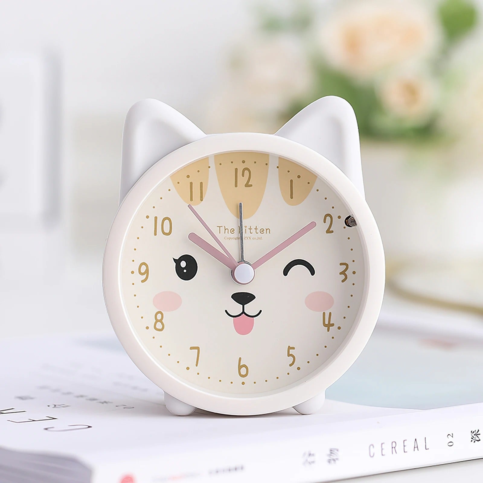 This Cat Alarm Clock brings a polished clock design and decorative character to the wall.