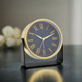 The Roman Numerals Alarm Clock, presented as a decorative timepiece for a thoughtfully designed home.